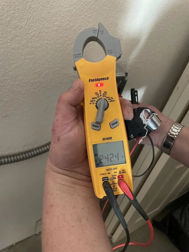 Voltage testing with clamp meter during Circuit Breaker Repair in Marion